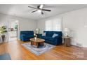 Cozy living room with hardwood floors, soft natural light, and comfortable seating for relaxing at 151 Third Creek Rd, Statesville, NC 28677
