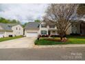 Well-maintained lawn and landscaping complement this two-story home with inviting curb appeal at 1540 Coatsworth Ln, Rock Hill, SC 29732