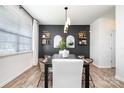 Contemporary dining room featuring a dark wood table, stylish chairs, and elegant decor at 1624 Savory Ln, Charlotte, NC 28216