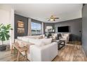 Modern living room with a large, comfortable white sectional sofa and a cozy fireplace at 1624 Savory Ln, Charlotte, NC 28216