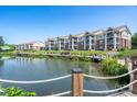 Beautiful lakefront condominiums with manicured landscaping and private balconies at 18511 Harborside Dr, Cornelius, NC 28031