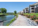 Scenic waterfront walkway lined with lush greenery and access to residences at 18511 Harborside Dr, Cornelius, NC 28031