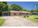 Brick home with carport and covered porch, offering convenient parking and outdoor space at 2526 Ashford Dr, Newton, NC 28658