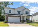 Beautiful home featuring stone accents, a two-car garage, and a well-maintained lawn at 4046 Armstrong Farm Dr, Belmont, NC 28012