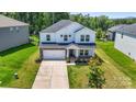 Aerial view of a house, showing its well-kept lawn, landscaping, and surrounding neighborhood at 4046 Armstrong Farm Dr, Belmont, NC 28012