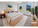 Bright bedroom with a cozy rug, large windows, stylish decor and hardwood furniture at 5013 Crandon Rd, Fort Mill, SC 29707