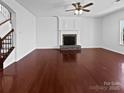 Spacious living room featuring a fireplace, hardwood floors and neutral paint at 5013 Crandon Rd, Fort Mill, SC 29707