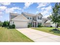 Beautiful two-story home with a well-manicured lawn, long driveway, and classic curb appeal at 5079 Nighthawk Dr, Fort Mill, SC 29707