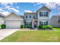 Charming two-story home with well-manicured lawn and inviting curb appeal in a desirable neighborhood at 5079 Nighthawk Dr, Fort Mill, SC 29707