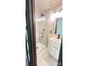Modern bathroom features glass enclosed shower, vanity with sink and contemporary fixtures at 616 W Marion St, Shelby, NC 28150