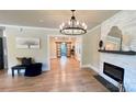 Bright and open living space featuring a fireplace and seamless flow to other rooms at 616 W Marion St, Shelby, NC 28150