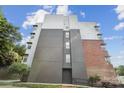 Modern apartment building exterior features a mix of brick, gray, and silver siding, plus a ramp at 630 Calvert St # 410, Charlotte, NC 28208