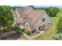 Overhead view showcases this townhome's mature landscaping, brick facade, and inviting curb appeal at 825 Rock Lake Gln, Fort Mill, SC 29715