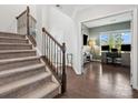 Spacious foyer with staircase leading to an office, showcasing hardwood floors at 1008 Whipcord Dr, Waxhaw, NC 28173