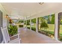 Inviting front porch with decorative plants and a rocking chair, perfect for relaxing at 1043 Linneys Mill Rd, Union Grove, NC 28689