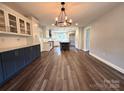 A wide-open kitchen with a central island, modern appliances, and hardwood floors at 1335 33Rd Avenue Ne Dr, Hickory, NC 28601