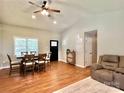 Open-concept living and dining area with hardwood floors, recessed lighting and ample natural light at 147 Dutchman Rd, Harmony, NC 28634