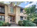 Charming building featuring unique architectural details and landscaping, enhancing curb appeal at 207 N Dotger Ave # C14, Charlotte, NC 28207