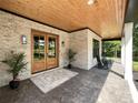 Inviting front porch with double doors, stylish brickwork, and cozy rocking chairs at 4023 Yesteryears Ln, Marshville, NC 28103