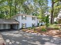 Two-story painted brick home with grey shutters and a connecting carport at 4618 Emory Ln, Charlotte, NC 28211