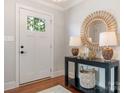 Bright foyer featuring a hardwood floor, interior view front door, and decorator table at 4618 Emory Ln, Charlotte, NC 28211