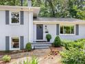 Charming brick home featuring a stylish front door and well-maintained landscaping at 4618 Emory Ln, Charlotte, NC 28211