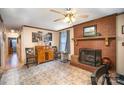 Inviting living room featuring a cozy fireplace, tile floors, and a stylish wooden cabinet at 753 Briarfield Rd, Rock Hill, SC 29730