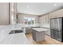 Modern kitchen with stainless steel appliances, a central island, and bright lighting at 1033 12Th Avenue Nw Dr, Hickory, NC 28601
