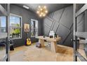 Modern office with unique wall design, decorative lighting, lots of natural light, and hardwood floors at 18027 Wilbanks Dr, Charlotte, NC 28278