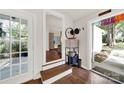 Inviting entryway with hardwood floors, a decorative mirror, and a view into the living spaces at 2314 Wolfe St, Charlotte, NC 28205