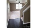 Inviting living room with hardwood flooring, neutral paint, and ample natural light at 2440 Mint Thistle Ct, Charlotte, NC 28269