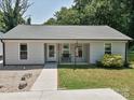 Inviting single-story home with a covered porch and neatly landscaped front yard at 285 Hannah Ave, Salisbury, NC 28147