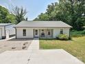 Cozy single-story home with a bench on the porch and a well-manicured lawn at 285 Hannah Ave, Salisbury, NC 28147