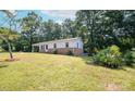 Expansive backyard with mature trees and lush green lawn, perfect for outdoor activities and relaxation at 326 Gorrell St, Shelby, NC 28152