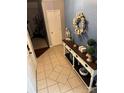 Inviting foyer with tile flooring and stylish console table at 328 Glenridge Ct, Indian Trail, NC 28079