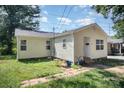 Side and front view of a simple, light yellow single-story home featuring a brick walkway at 333 Friendship Dr, Rock Hill, SC 29730