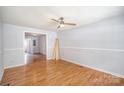 Living room with wood floors, a ceiling fan and a view into other rooms at 333 Friendship Dr, Rock Hill, SC 29730