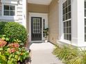 Inviting front entrance with a black door, white trim, and a well-maintained landscape at 7057 Shenandoah Dr, Fort Mill, SC 29707