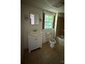 Modest bathroom with a classic vanity, tiled shower/bath combo, and functional fixtures at 1008 Packard Ave, Kannapolis, NC 28083
