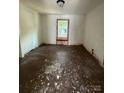 Bedroom featuring original wood floors and windows, awaiting a fresh new design at 1008 Packard Ave, Kannapolis, NC 28083
