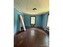 Bedroom featuring original wood floors and windows, awaiting a fresh new design at 1008 Packard Ave, Kannapolis, NC 28083