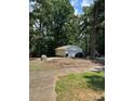 A detached garage featuring ample space for multiple vehicles and storage at 11204 Williams Rd, Mint Hill, NC 28227