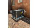 Modern HVAC unit set against a brick exterior wall, providing efficient climate control at 11204 Williams Rd, Mint Hill, NC 28227