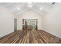 Open-concept living room with vaulted ceilings, hardwood floors, and seamless flow to the kitchen at 1189 Quiet Acres Rd, Rock Hill, SC 29732
