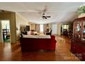 Spacious living room with a fireplace and access to the dining room at 1341 Pleasant Hill Church Rd, Wadesboro, NC 28170