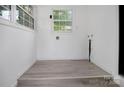 Clean, bright laundry room with fresh paint and new flooring at 2215 Hodgin St, Gastonia, NC 28056