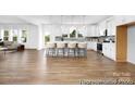 Open concept kitchen with sleek modern appliances, an island with seating, and bright lighting at 233 Wheatfield Dr # 102P, Statesville, NC 28677