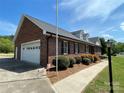 Brick home with attached garage providing ample parking and storage space at 2515 Myra Ln, Lincolnton, NC 28092