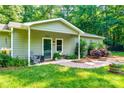 Inviting front porch with brick path, comfortable seating, and well-maintained landscaping details at 2984 Starnes Dr, Rock Hill, SC 29730