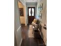 Inviting entryway with wood floors, a decorative chalkboard, and a cozy bench at 3210 Crow Row, Monroe, NC 28112